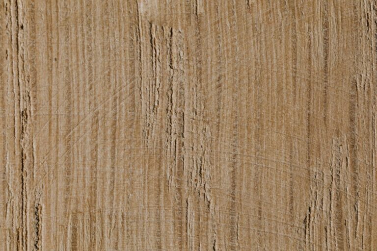 Close-up view of a textured wooden surface with natural grain pattern.