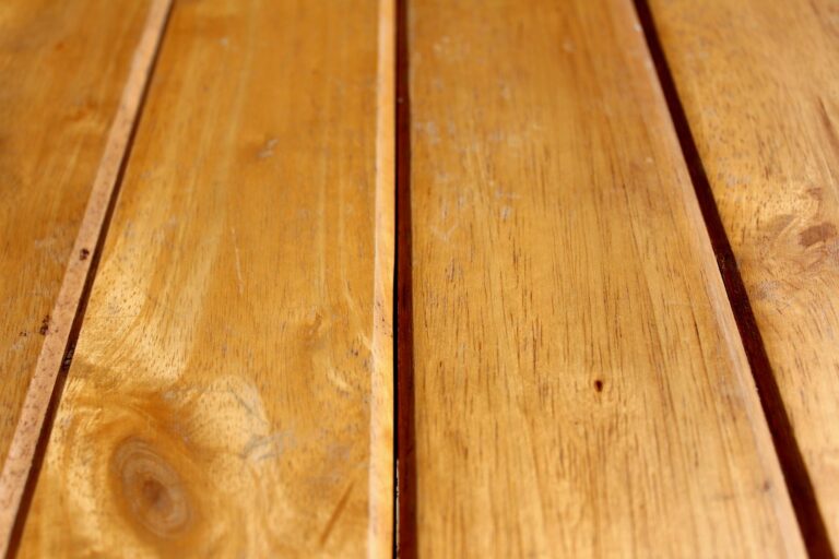 Detailed view of natural wooden planks with distinctive grain and texture.